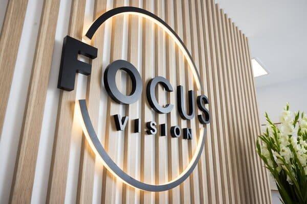 Focus Vision clinic reception area with logo