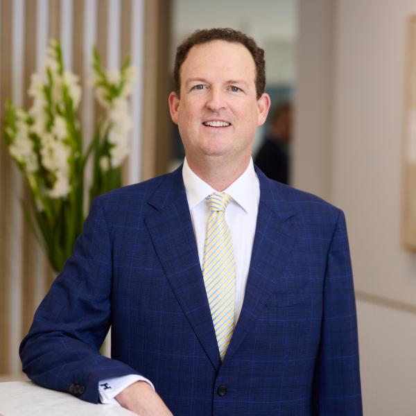 A professional headshot of Dr, Brendan Cronin